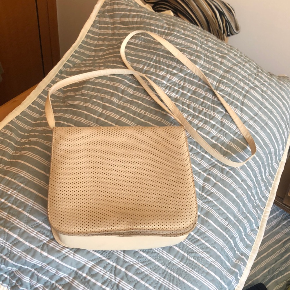 Cream colored leather purse.